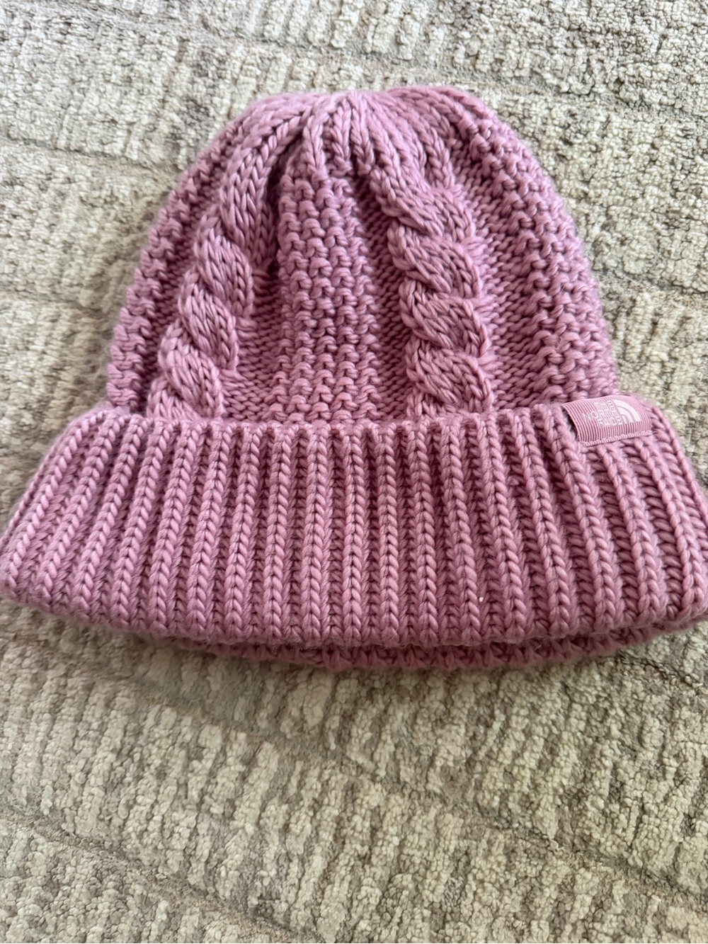 The North Face women’s “oh mega Beanie” in pink cable knit one size